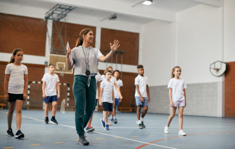 gym teacher leading a class - Sanford fit