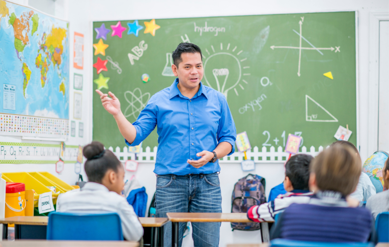 Male teacher in a classroom - Sanford fit