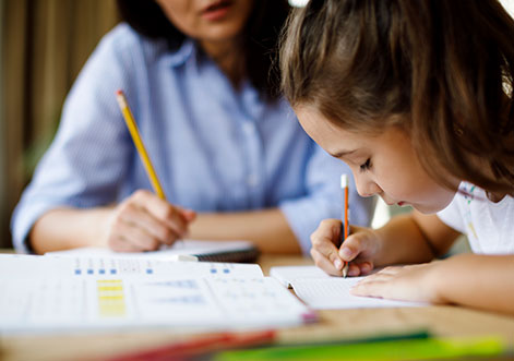 Child sitting at desk doing school work