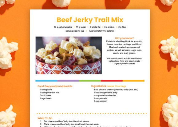 image of beef jerky trail mix and popcorn in a bowl with recipe card