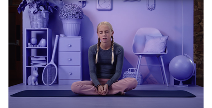 child sitting on yoga mat deep breathing- sanford fit