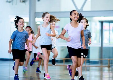 Kids running in gym during fitClub