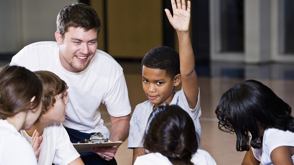 adult leader teaching kids about healthy habits