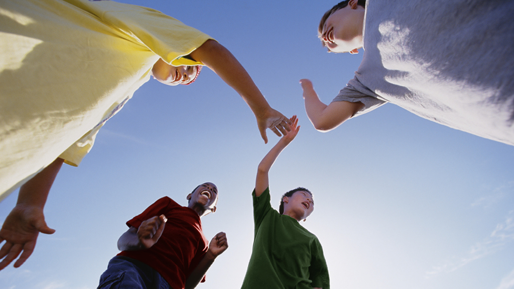 group of kids encouraging one another