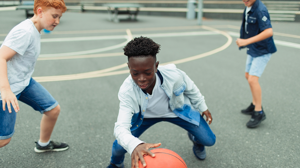 Children playing basketball together - Sanford fit