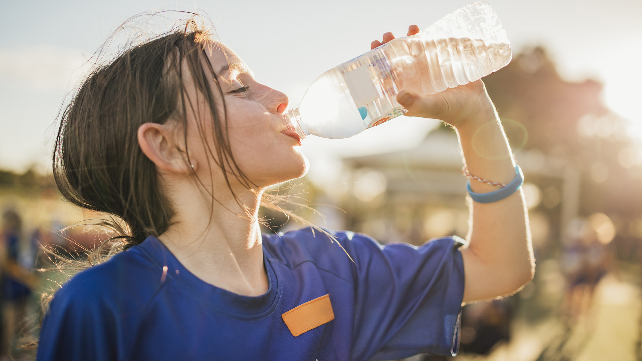 young girl drinking from a water bottle-Sanford Fit
